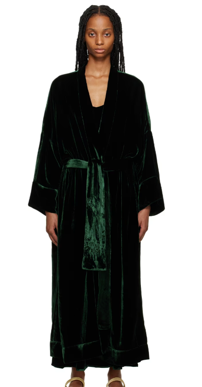 A woman wearing ASCENO green athens robe