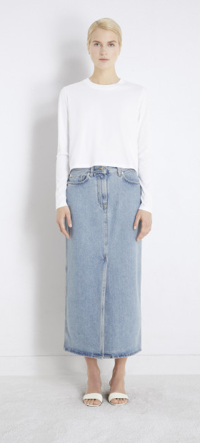 A woman wearing Loulou Studio rona organic denim midi skirt