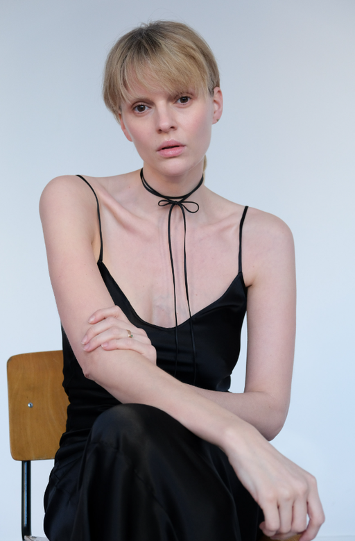 A woman wearing Saskia Diez silk bow choker
