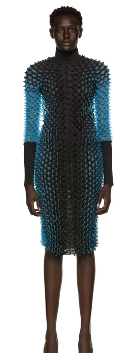 A woman wearing CHET LO black & blue evening gown