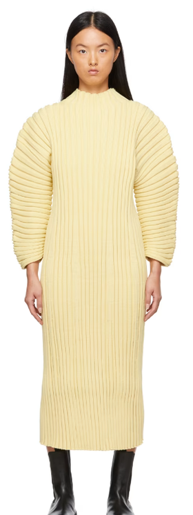 A woman wearing CFCL yellow column dress