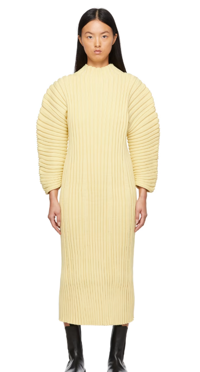 A woman wearing CFCL yellow column dress