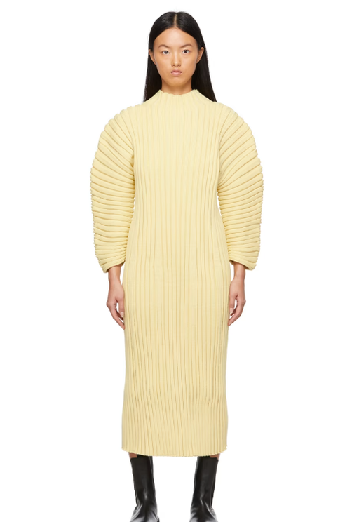A woman wearing CFCL yellow column dress