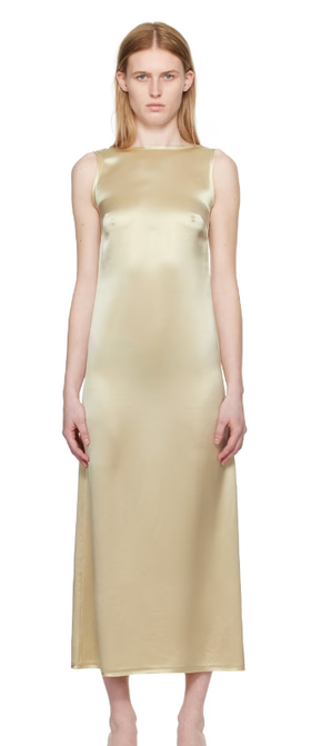 A woman wearing BY MALENE BIRGER off-white audette maxi dress