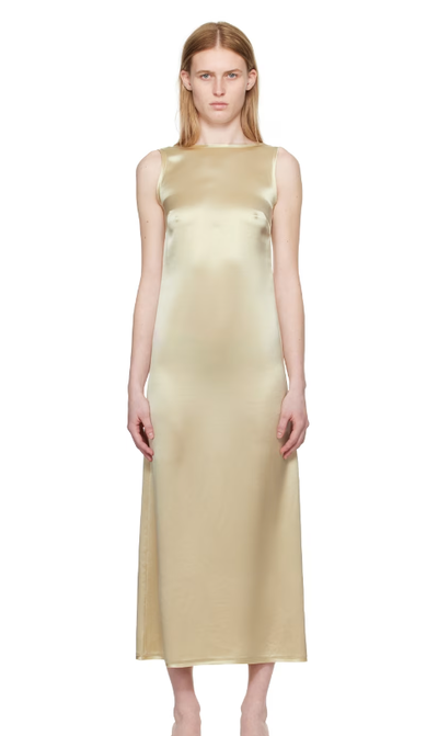 A woman wearing BY MALENE BIRGER off-white audette maxi dress