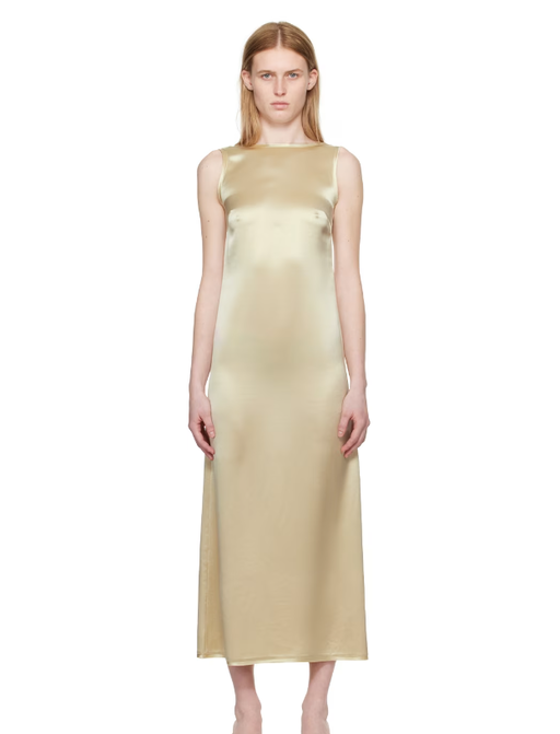 A woman wearing BY MALENE BIRGER off-white audette maxi dress