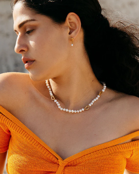 A woman wearing Loveness Lee dio aurum recycled silver earrings