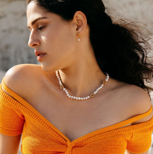 A woman wearing Loveness Lee dio aurum recycled silver earrings