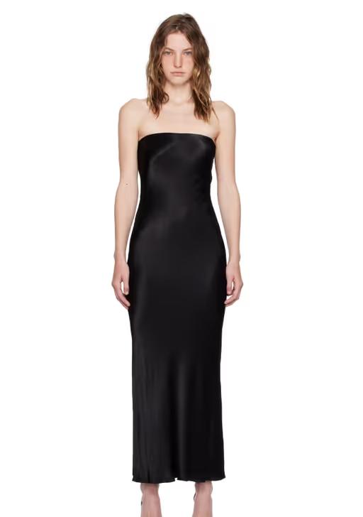 A woman wearing BEC + BRIDGE black moon dance maxi dress