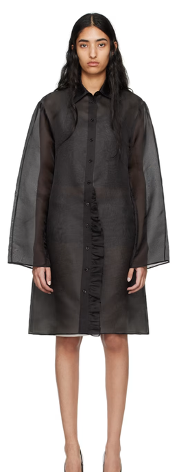 A woman wearing BITE black radieux minidress