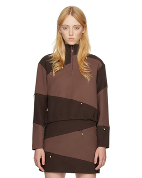 A woman wearing DANIËLLE CATHARI brown cotton sweater
