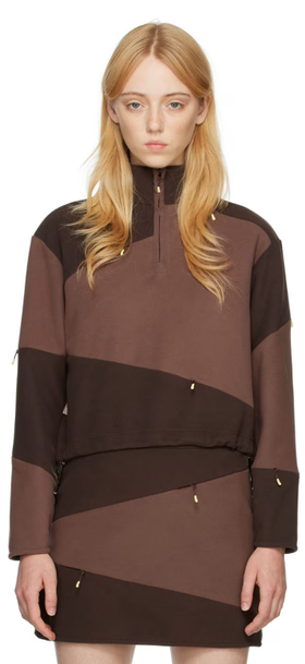 A woman wearing DANIËLLE CATHARI brown cotton sweater