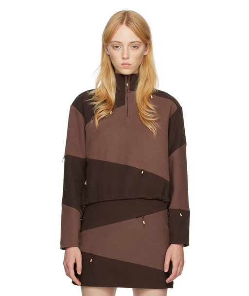 A woman wearing DANIËLLE CATHARI brown cotton sweater