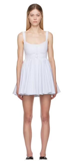 A woman wearing ALAÏA white & blue skater minidress