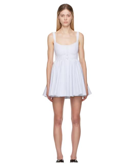 A woman wearing ALAÏA white & blue skater minidress