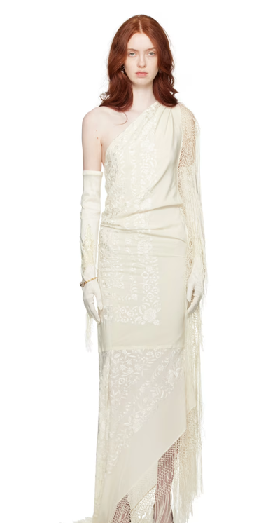 A woman wearing CONNER IVES off-white piano shawl maxi dress
