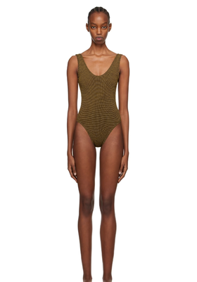 A woman wearing BOND-EYE brown mara swimsuit