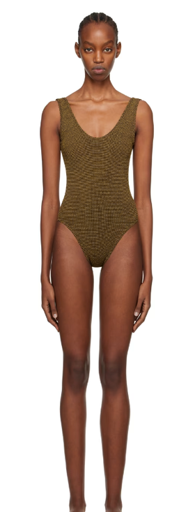 A woman wearing BOND-EYE brown mara swimsuit