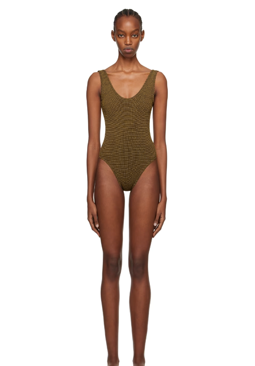 A woman wearing BOND-EYE brown mara swimsuit
