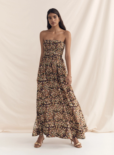 A woman wearing Peony florence strapless maxi dress