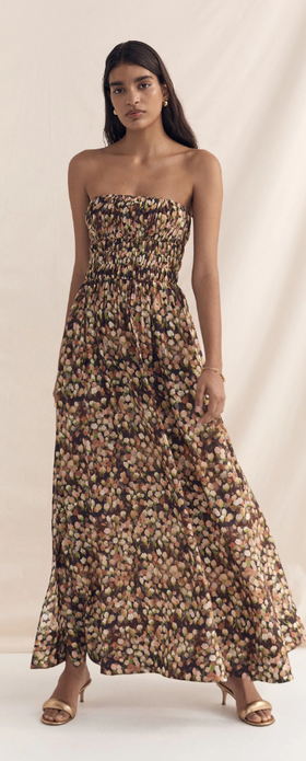 A woman wearing Peony florence strapless maxi dress