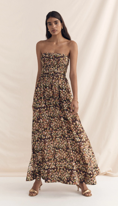 A woman wearing Peony florence strapless maxi dress