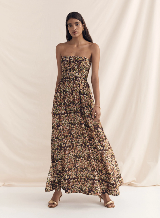 A woman wearing Peony florence strapless maxi dress