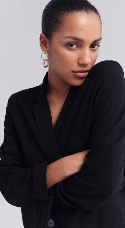 A woman wearing Trine Tuxen Jewelry equal earring