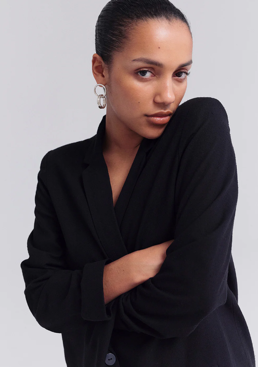 A woman wearing Trine Tuxen Jewelry equal earring