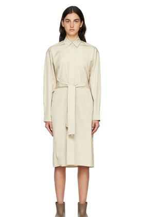 A woman wearing ARCH THE beige two-way twisted midi dress
