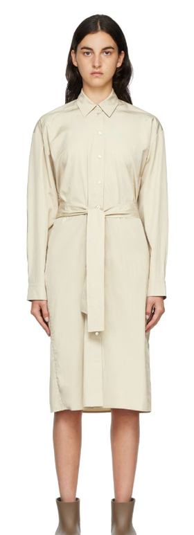 A woman wearing ARCH THE beige two-way twisted midi dress