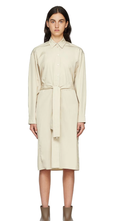 A woman wearing ARCH THE beige two-way twisted midi dress