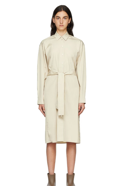 A woman wearing ARCH THE beige two-way twisted midi dress