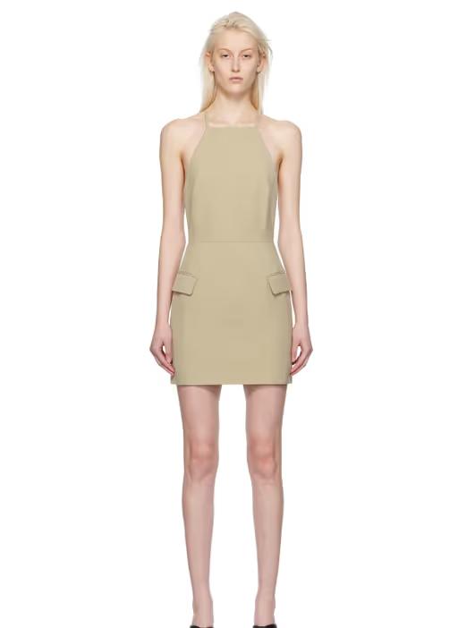 A woman wearing CAMILLA AND MARC beige arwin minidress
