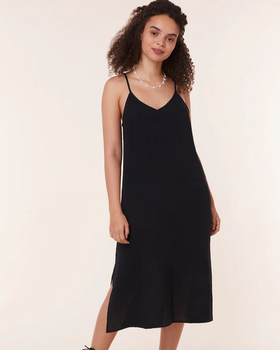 A woman wearing Andie black the barreta dress