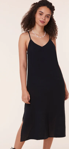 A woman wearing Andie black the barreta dress