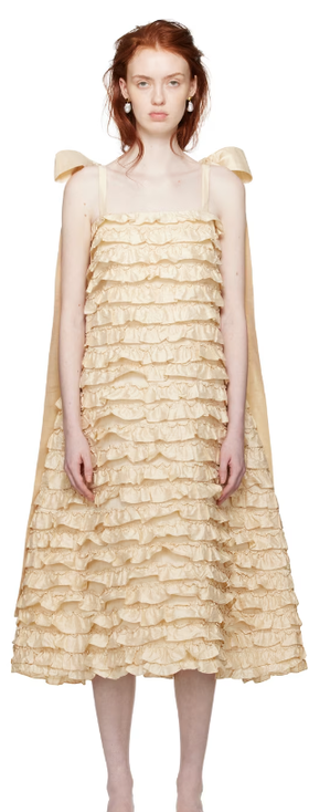 A woman wearing CAWLEY off-white bells maxi dress