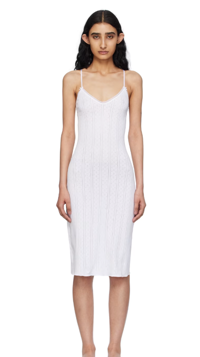 A woman wearing COU COU white 'the midi slip' midi dress