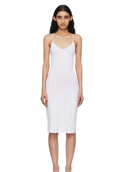 A woman wearing COU COU white 'the midi slip' midi dress