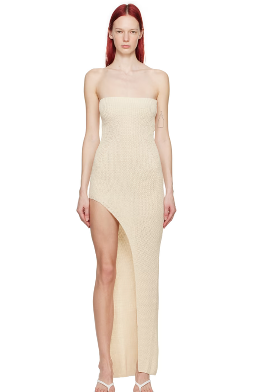 A woman wearing Aya Muse off-white vented midi dress