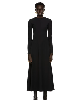 A woman wearing CAES black jersey dress