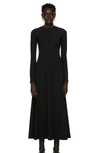 A woman wearing CAES black jersey dress
