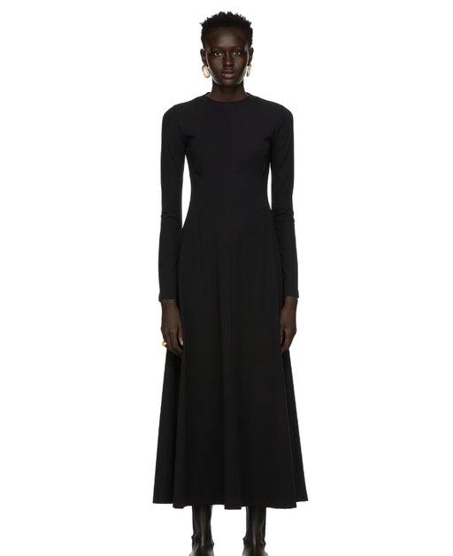 A woman wearing CAES black jersey dress