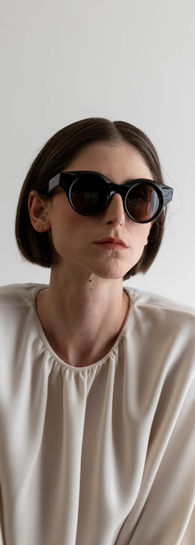 A woman wearing Lapima black matilde sunglass