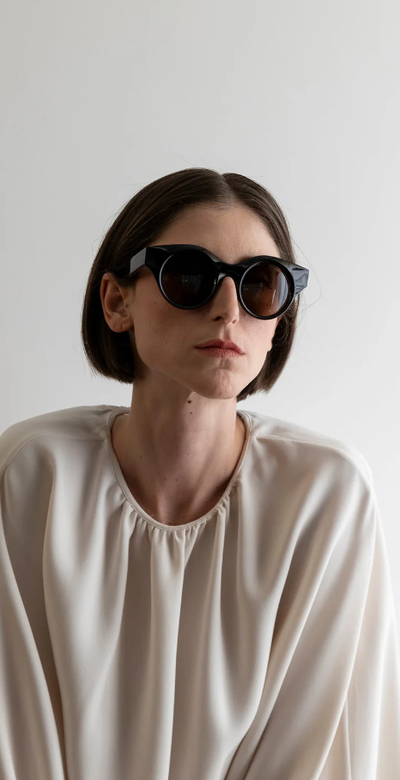 A woman wearing Lapima black matilde sunglass