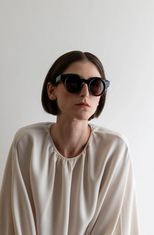 A woman wearing Lapima black matilde sunglass