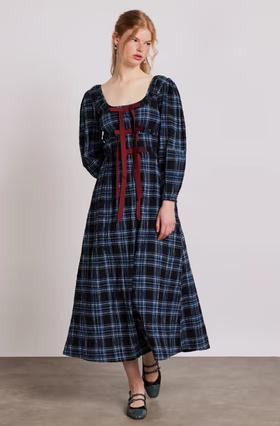 A woman wearing Damson Madder dakota midi dress - blue check