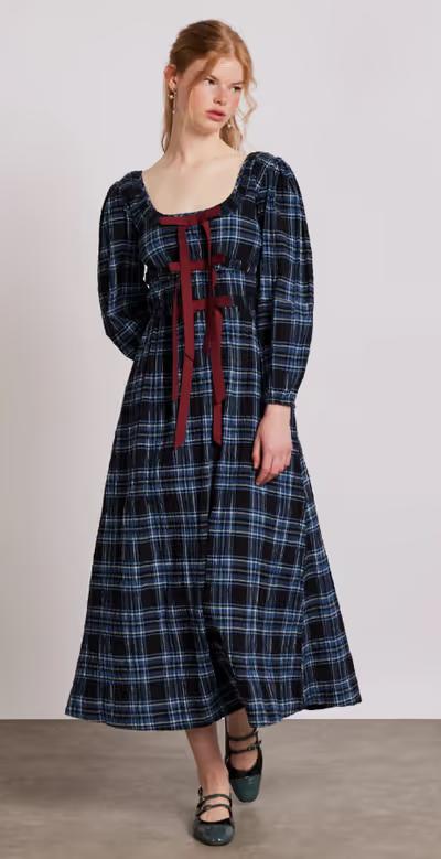 A woman wearing Damson Madder dakota midi dress - blue check