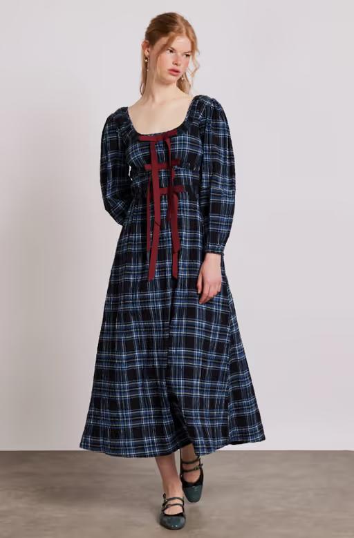 A woman wearing Damson Madder dakota midi dress - blue check