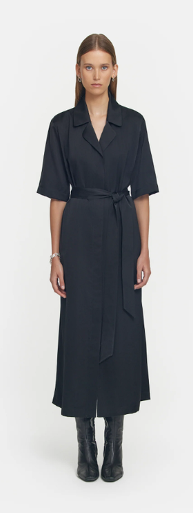 A woman wearing Viktoria & Woods black juilliard shirt dress